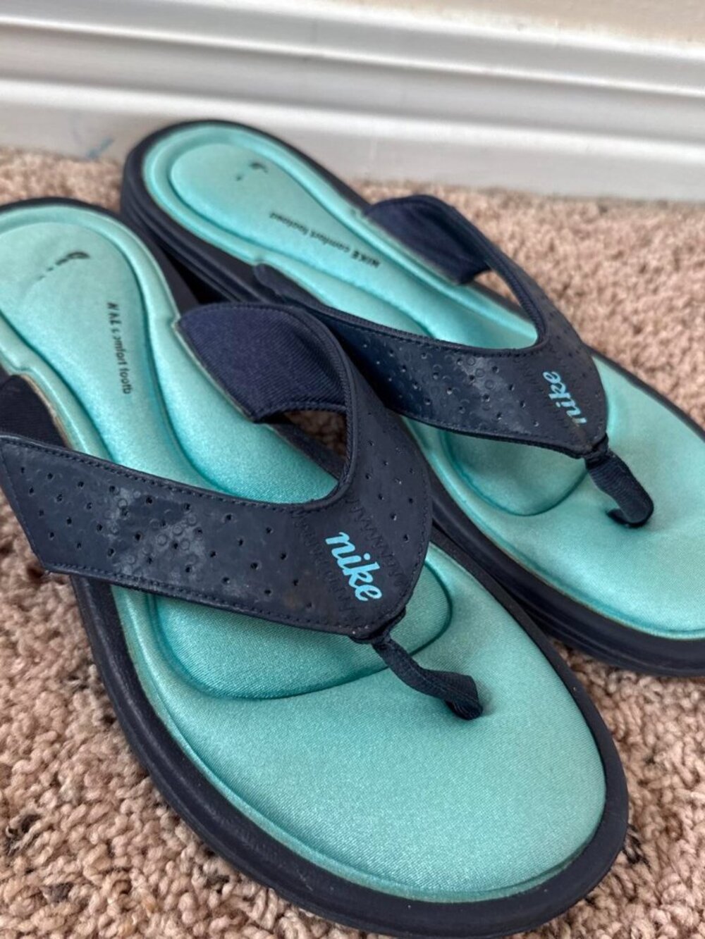 Nike navy and blue flip flops with comfort foot bed
